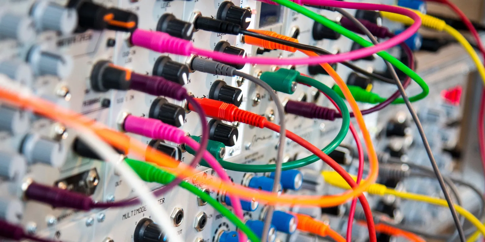 Complicated! a complicated tangle of coloured wires plugged into a board