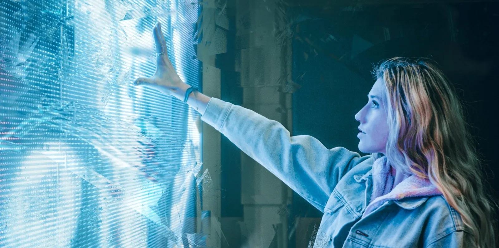 josh-hild-WjZ4eaHq9G4-unsplash change symbolised by woman touching electronic screen